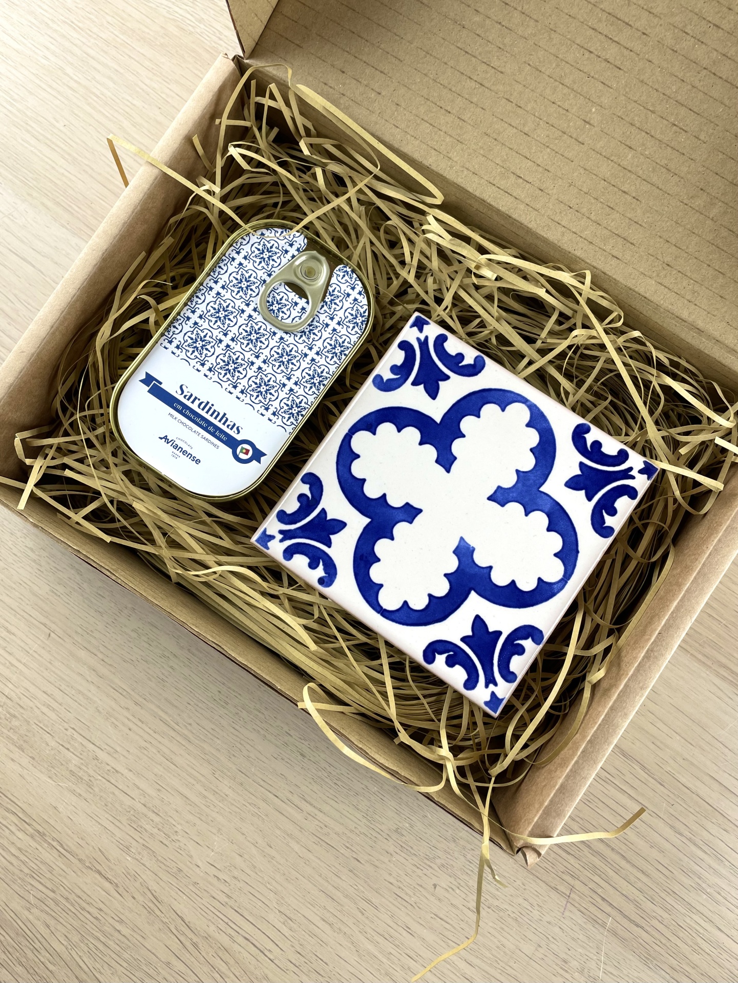 Gift box with ceramic tile and decorated tin can