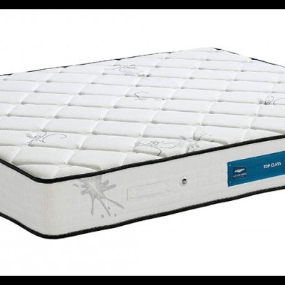 Colchão branco acolchoado com etiqueta azul e bordas cinza