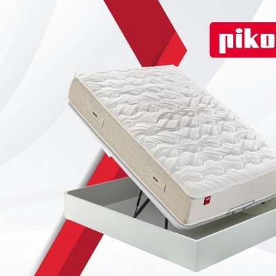 Colchão branco Pikolin com base cinza claro elevada