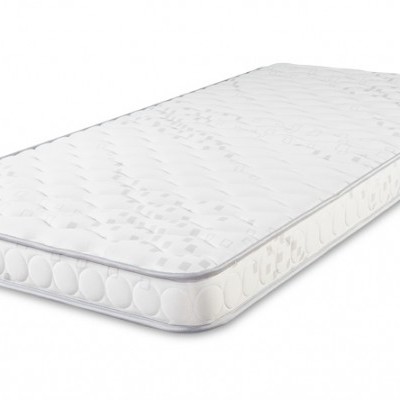 Colchão branco acolchoado com padrão de pontos e bordas com círculos