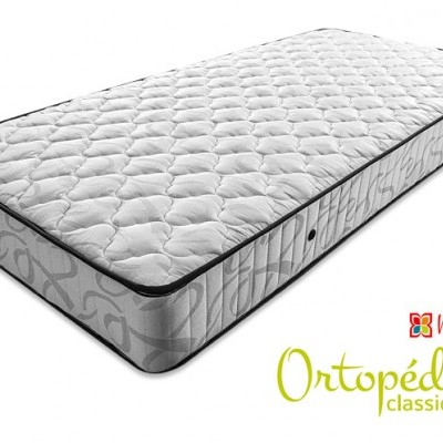 Colchão ortopédico branco com laterais cinzentas e acabamento preto, com texto Mindol GRUPO e Ortopédico classic plus