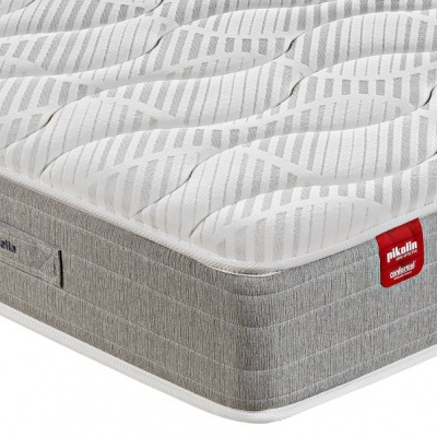 Colchão cinza claro e branco com padrão riscado, etiquetas 'Palma Comfort' e 'Palma Molas Ensacadas'