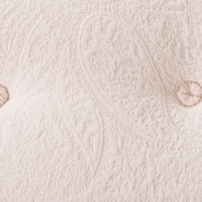 tecido bege texturizado com botões acolchoados