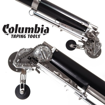 Ferramenta de tapeçaria Columbia Taping Tools preta e prateada com rodas e engrenagens.