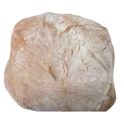 Pedra bege irregular com textura rugosa