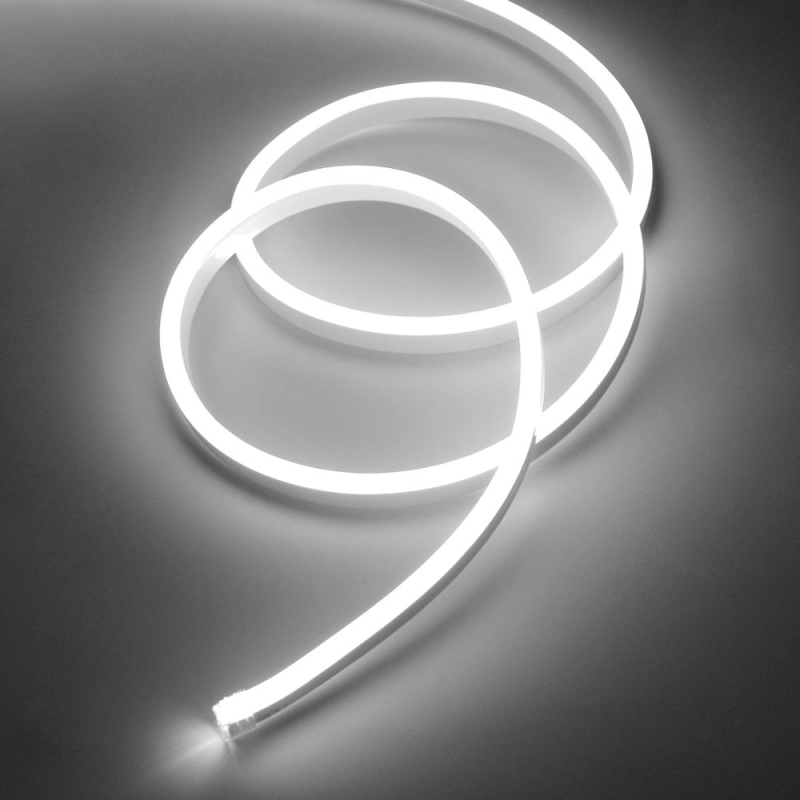 Fita de luz LED branca em espiral sobre superfície cinzenta