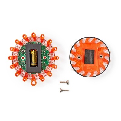 Componentes redondos eletrônicos com luzes LED laranja e bateria AA visível, parafusos ao lado.