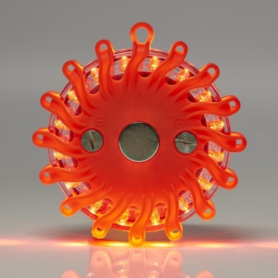 Dispositivo circular laranja com luzes LED acesas