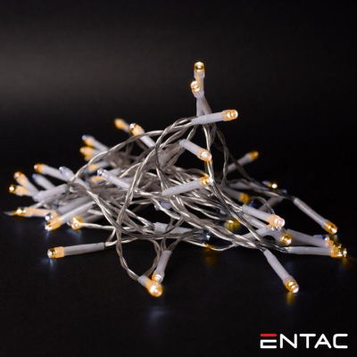 Cordão de luzes LED amareladas com fios cinza sobre fundo preto