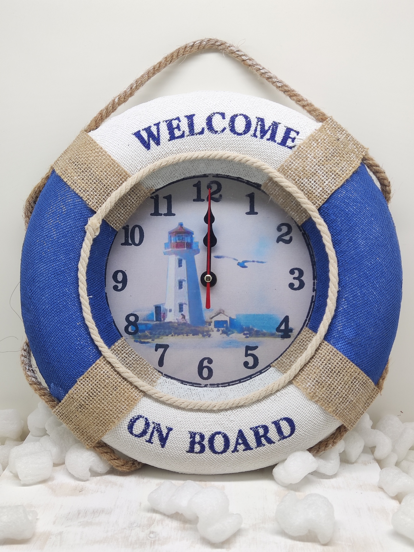 Relógio decorativo em forma de bóia salva-vidas com texto Welcome on Board