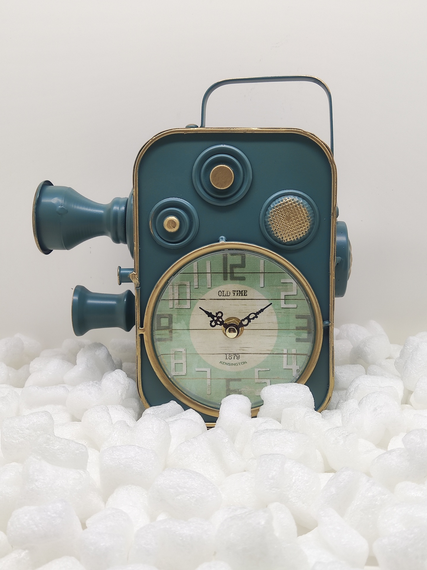 Relógio vintage em forma de câmara de filmar azul e dourada