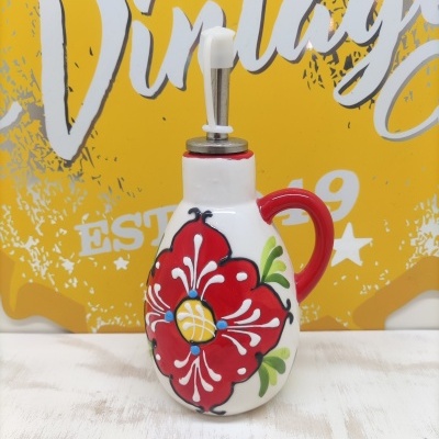 Frasco doseador de cerâmica decorado com flor vermelha e tampa metálica