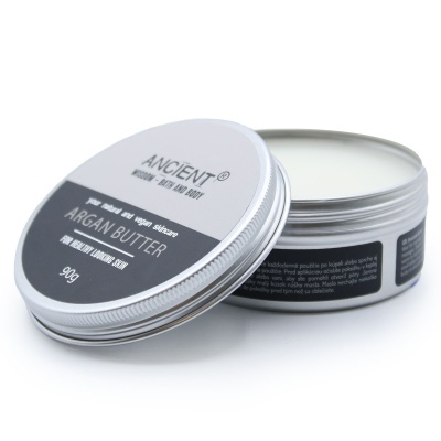 Pote metálico prateado aberto com manteiga corporal e rótulo ANCIENT Argan Butter.