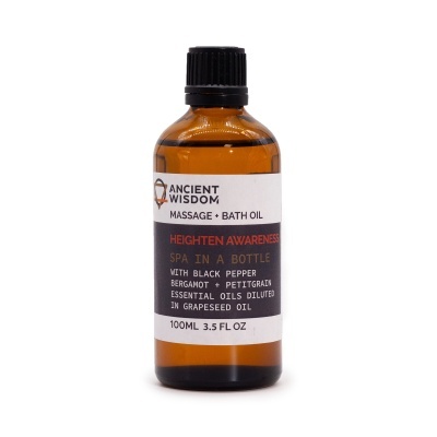 Frasco âmbar com óleo de massagem e banho Ancient Wisdom com etiqueta preta e branca.