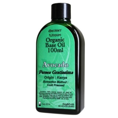 Frasco preto de óleo base orgânico de abacate com rótulo verde