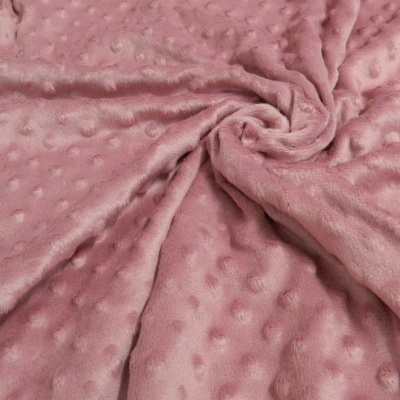 Tecido de pelúcia rosa com padrão de bolinhas em relevo