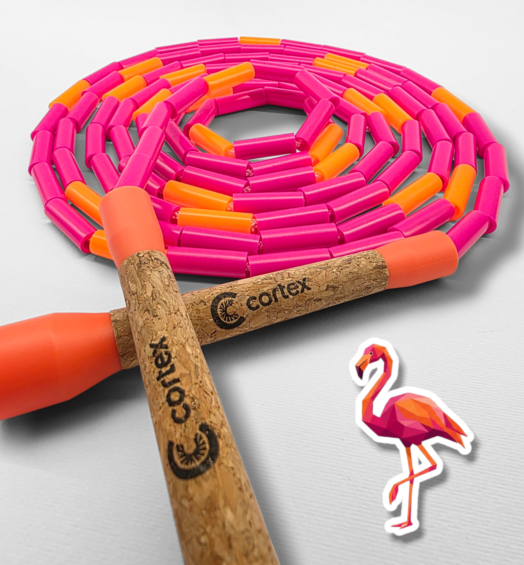 Pink and orange beaded jump rope with cork handles and flamingo sticker