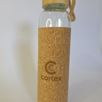Glass water bottle with cork sleeve and wooden cap, cortex logo