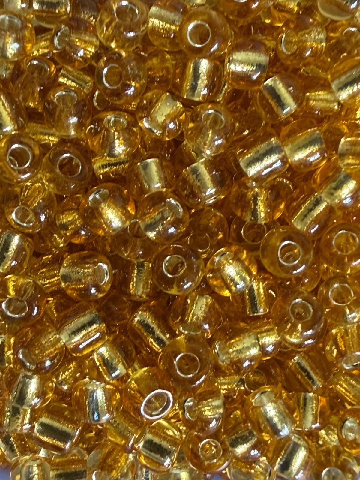 miudezas âmbar com interior dourado para bijuteria
