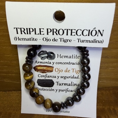 Pulseira artesanal com contas de hematite e olho de tigre em cartão com informações em espanhol