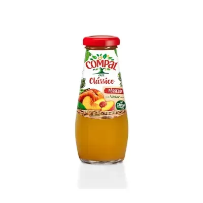 Garrafa de sumo de pêssego Compal Clássico com tampa vermelha e rótulo com imagem de pêssegos