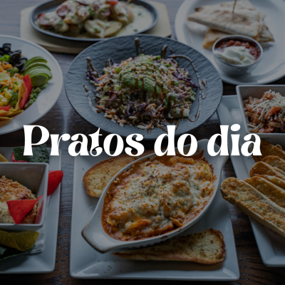 Pratos variados de comida dispostos numa mesa, como saladas, lasanha e tacos, com texto 'Pratos do dia'.