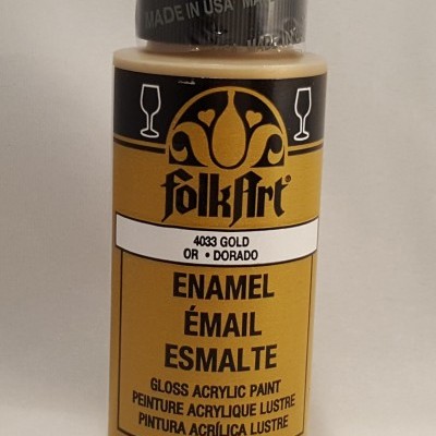 Frasco de tinta acrílica dourada FolkArt com tampa preta e texto 'MADE IN USA'