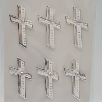 Pack de nove cruzes decorativas prateadas com pedras brilhantes em embalagem artos com fundo azul