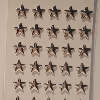 Pacote de estrelas prateadas em relevo para decoração