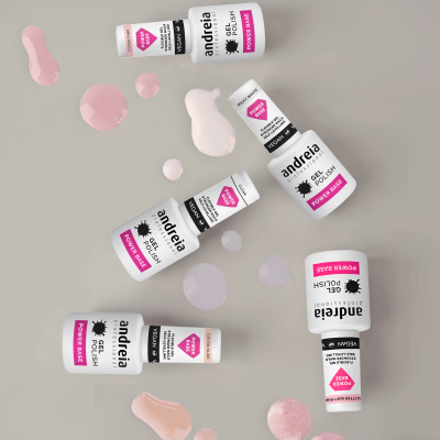 Esmaltes Andreia Power Base e Power Gel Polish com manchas de esmalte em fundo cinzento