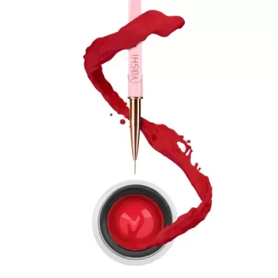 Pincel de maquilhagem rosa com tinta vermelha cremosa