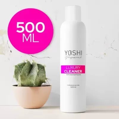 Frasco branco de luxo cleaner YOSHI de 500 ml ao lado de vaso com planta suculenta