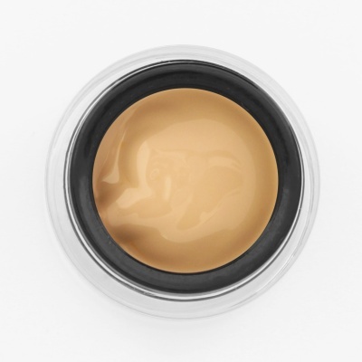 Frasco de creme cor bege claro, visão superior