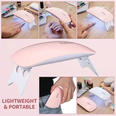 Mini lâmpada LED cor-de-rosa para unhas, portátil e leve, em várias posições.