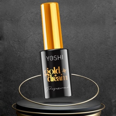 Frasco de verniz para unhas preto com tampa dourada e texto 'YOSHI gold dream'