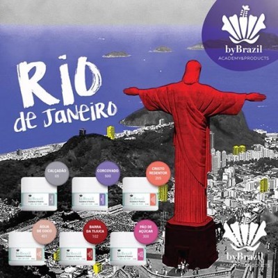 Produtos cosméticos by Brazil com rótulos coloridos e imagem artística do Rio de Janeiro com Cristo Redentor vermelho.