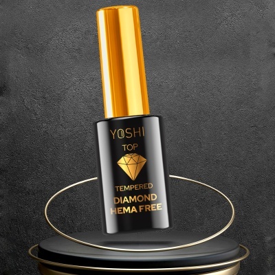 Frasco preto de verniz para unhas com tampa dourada e texto dourado