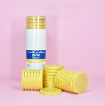 Pastilhas amarelas e frasco com etiqueta Traditonnelles Techno Galets GIALLA
