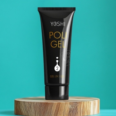 Tubo preto de gel UV YOSHI POLI GEL sobre suporte de madeira