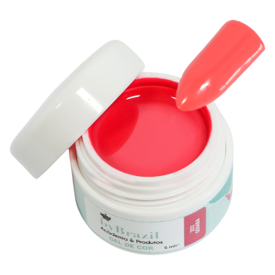 Pote branco aberto com gel de cor rosa vibrante e unha artificial da mesma cor