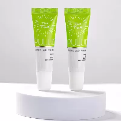 Dois tubos de plástico com tampa branca e parte superior verde da marca PULUX em suporte branco.