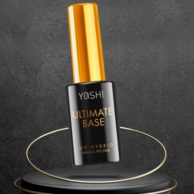 Frasco de verniz para unhas preto e dourado da marca YOSHI com texto ULTIMATE BASE UV HYBRID