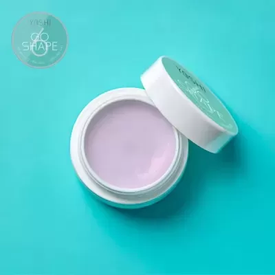 Frasco branco aberto com creme lilás e tampa com texto YOSHI GO SHAPE