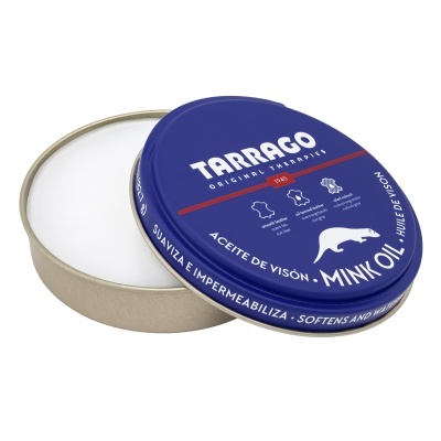 Lata azul de creme para cuidados de couro com tampa aberta, mostrando creme branco no interior.