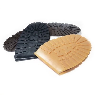 Solas de sapato em borracha preta e castanha clara com padrão antiderrapante