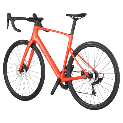 Bicicleta de estrada laranja com componentes pretos e pneus Schwalbe.
