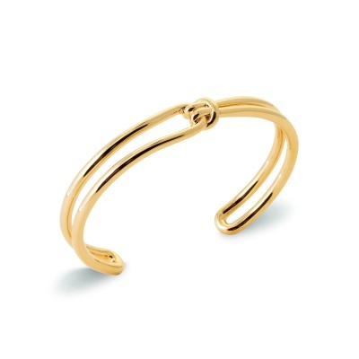 Pulseira dourada com nó central em metal brilhante