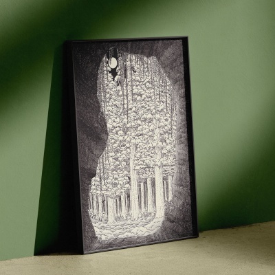 Quadro preto com ilustração de formação rochosa em branco e preto encostado numa parede verde.