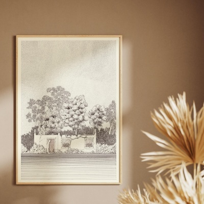 Pôster emoldurado com desenho a preto e branco de natureza e casa numa parede bege