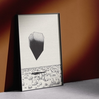 Quadro preto e branco com ilustração geométrica e paisagem de pedras encostado à parede